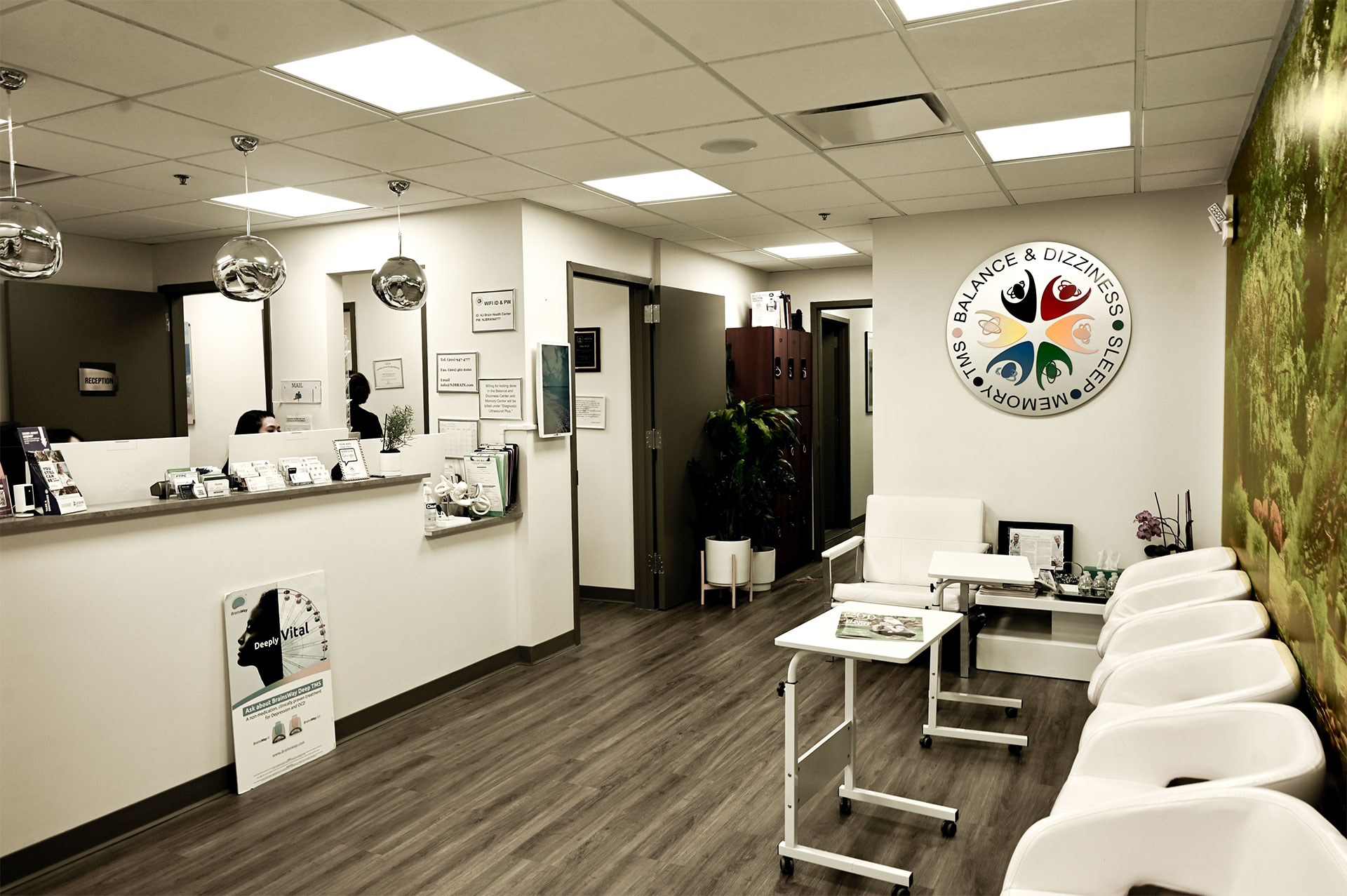 The image shows an interior space that appears to be a hair salon, featuring a reception area with a desk, signage, and a counter.